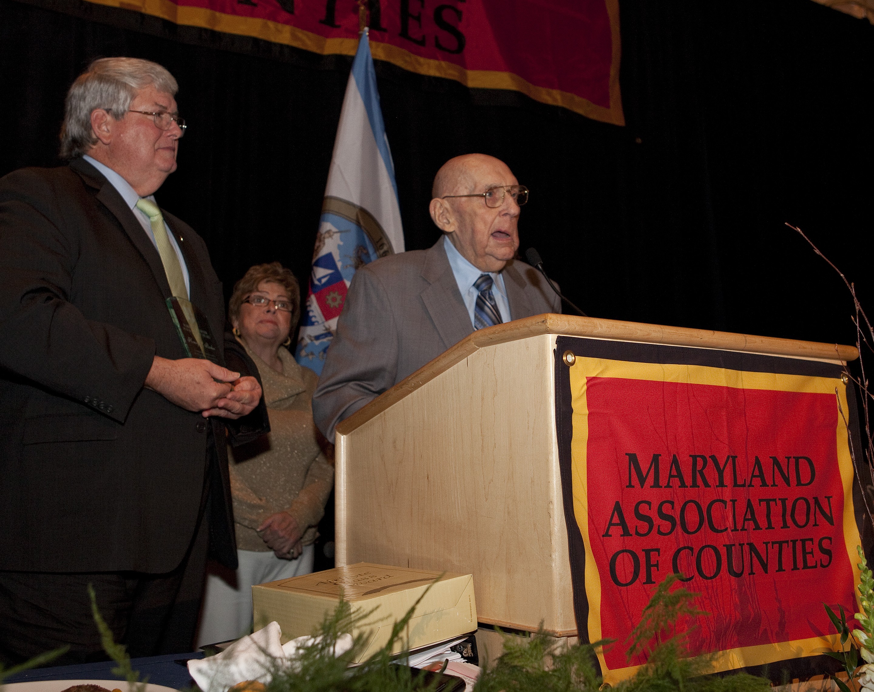 Herny Parker receiving award at podium